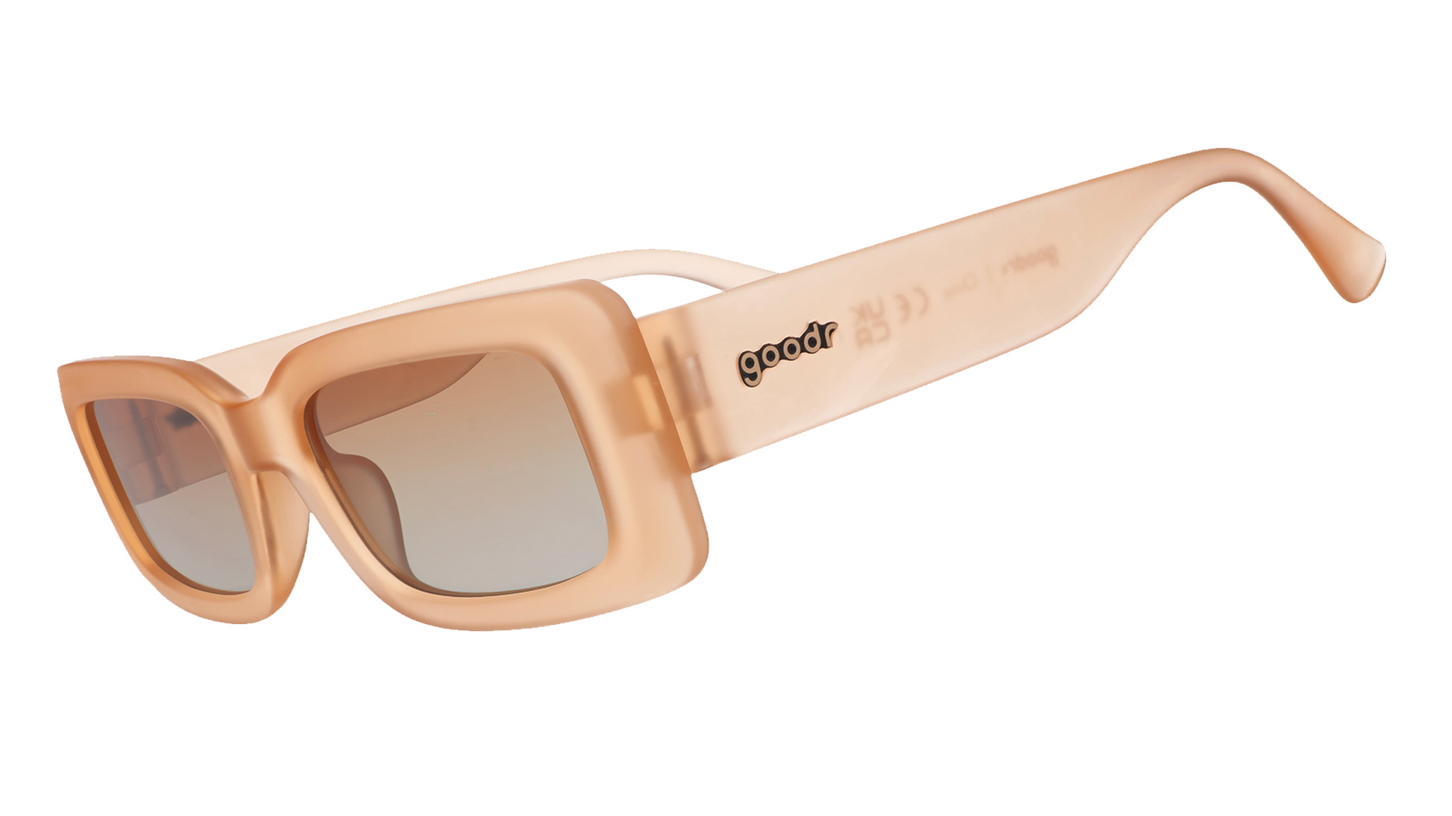 Three-quarter angle view of translucent peach rectangular Luxe G sunglasses with orange-gold gradient lenses.