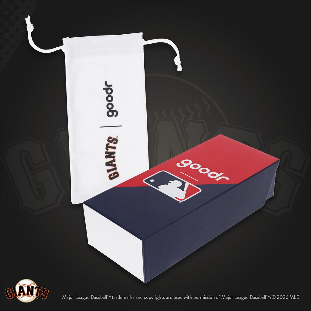 Photograph of custom packaging, featuring a white Giants-branded microfiber bag and MLB-themed product box.