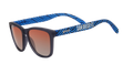 Angled view of shades tilted down. Dark gray frames w/ blue waves, San Diego FC on temples+orange gold gradient lenses.