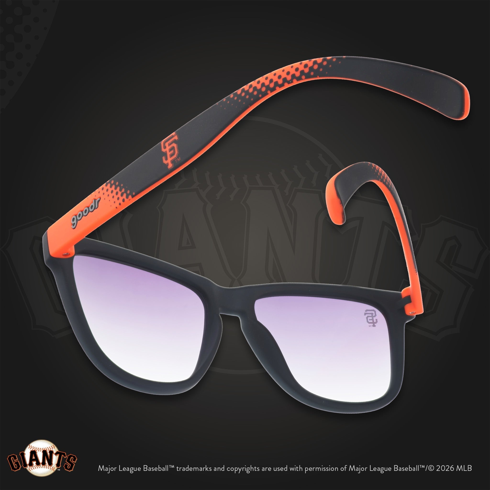 Black and orange Giants shades photographed from behind, floating against a black background with the SF logo.