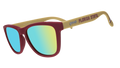 A pair of sunglasses on a white background with maroon frames, blue and green lenses, and gold temples with "Florida State" written in maroon along the temples.