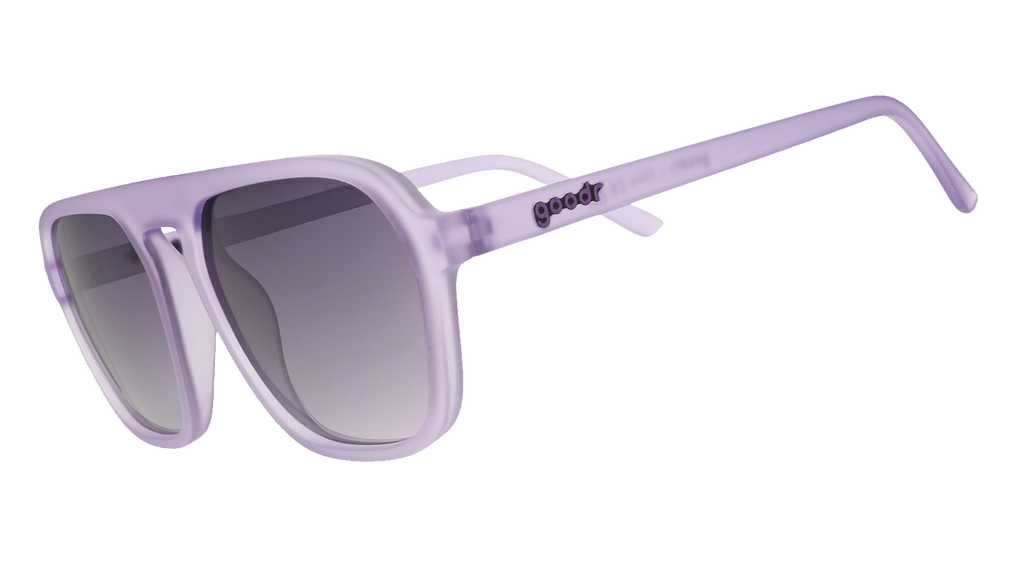 Three-quarter angle view of translucent pale purple aviator Retro G sunglasses with black gradient lenses.