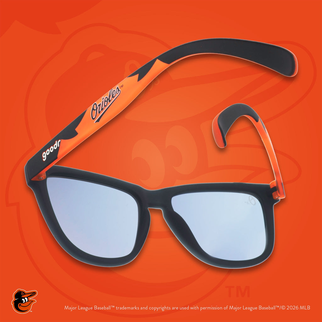 Black and orange shades photographed from behind, floating against an orange background featuring the O's logo.