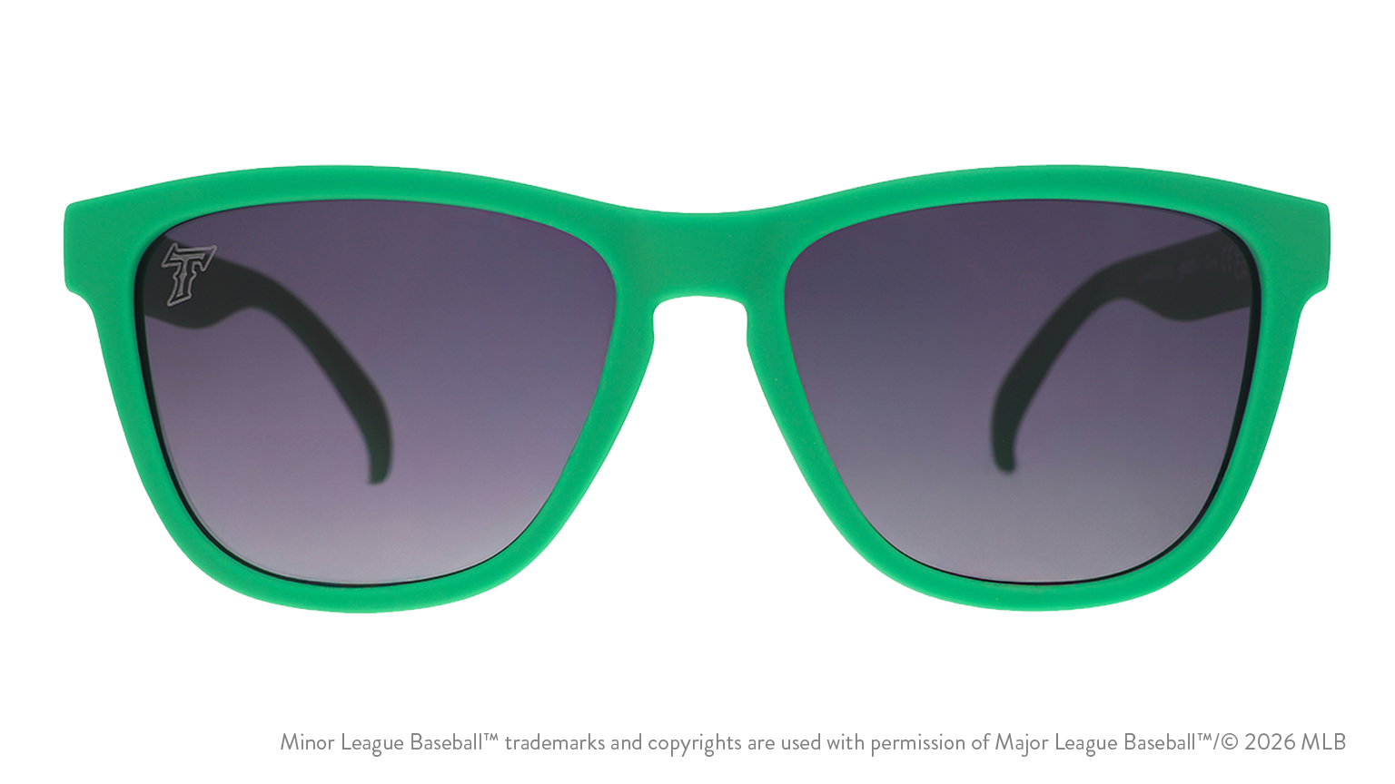 Front view of sunglasses. Solid green front frame. Black gradient lenses. Tides logo etching in top corner of lens.