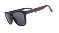 Three-quarter angle view of MLS New England Revolution shades tilted down. Black+red frames. Black non-reflective lenses.