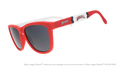 Three-quarter angle view of a pair of red, white, and blue sunglasses featuring the Angels' "halo A" logo on the arm.