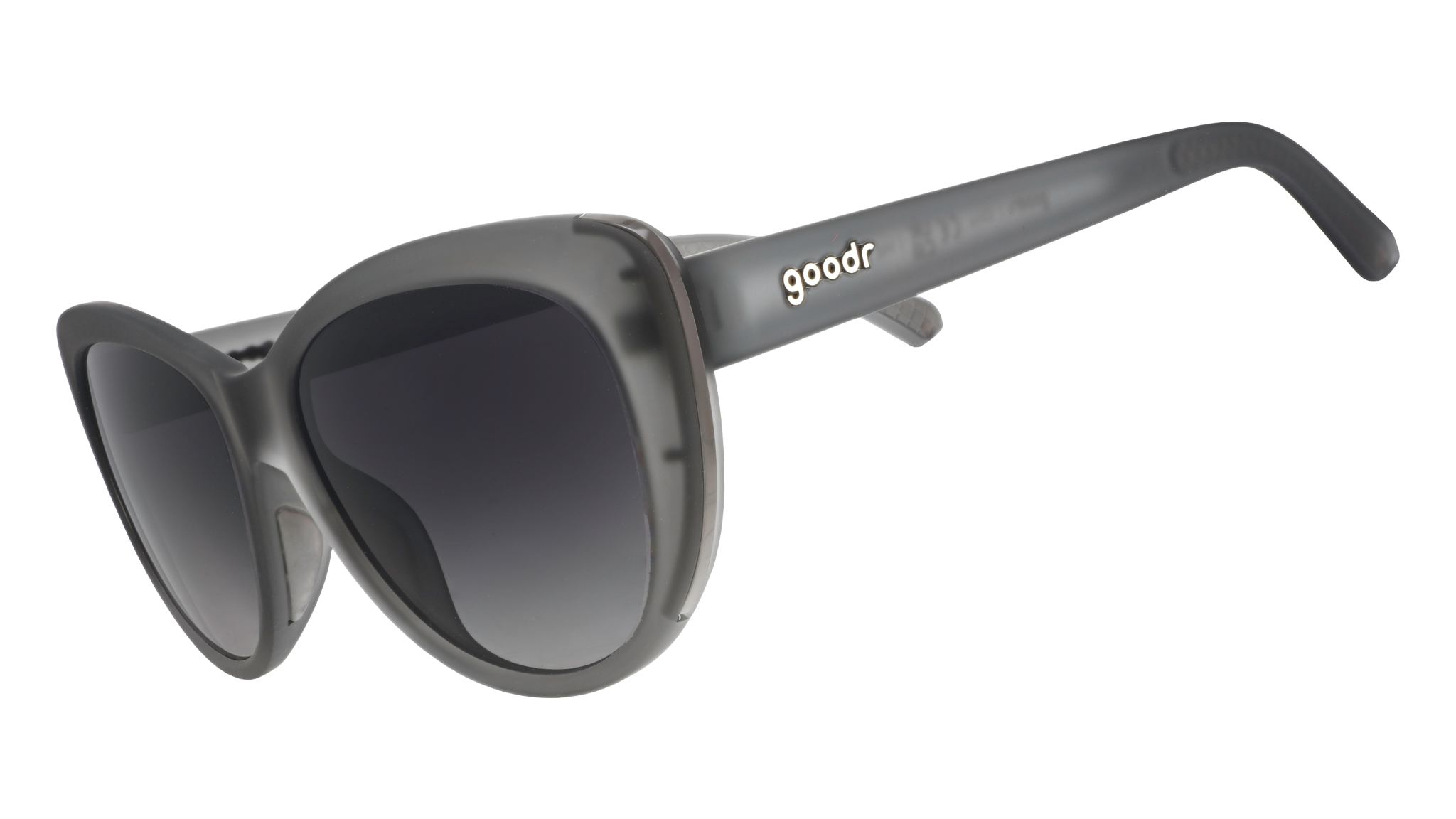 Three-quarter angle view of translucent gray cat-eye sunglasses with black gradient lenses.