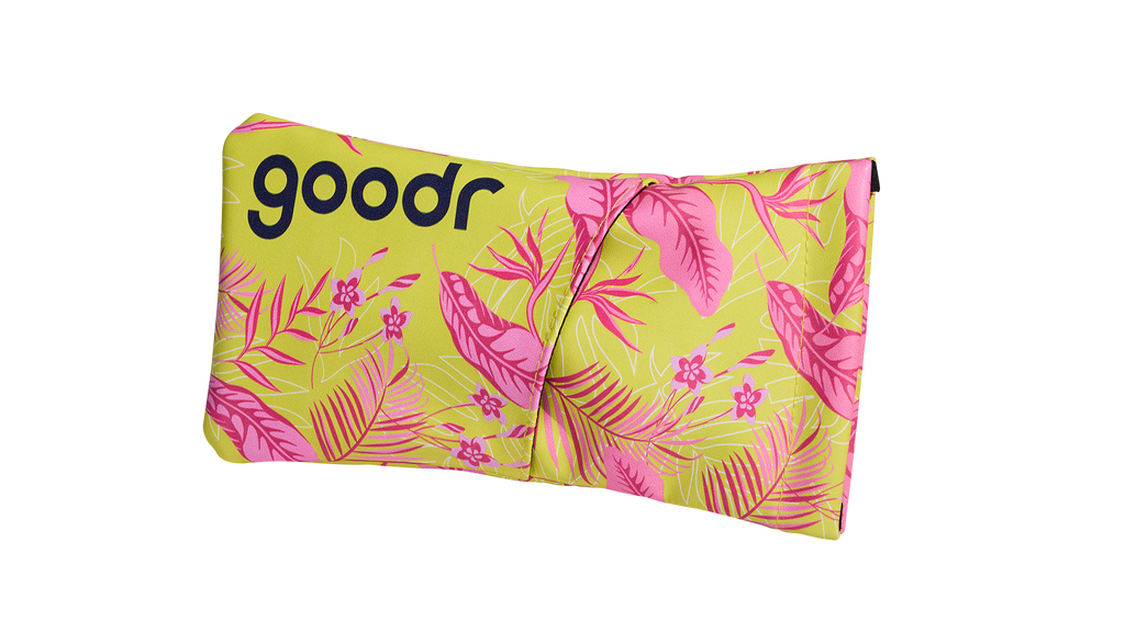 Three-quarter angle view of a soft fabric sunglasses case featuring a pink and yellow tropical leaf design.