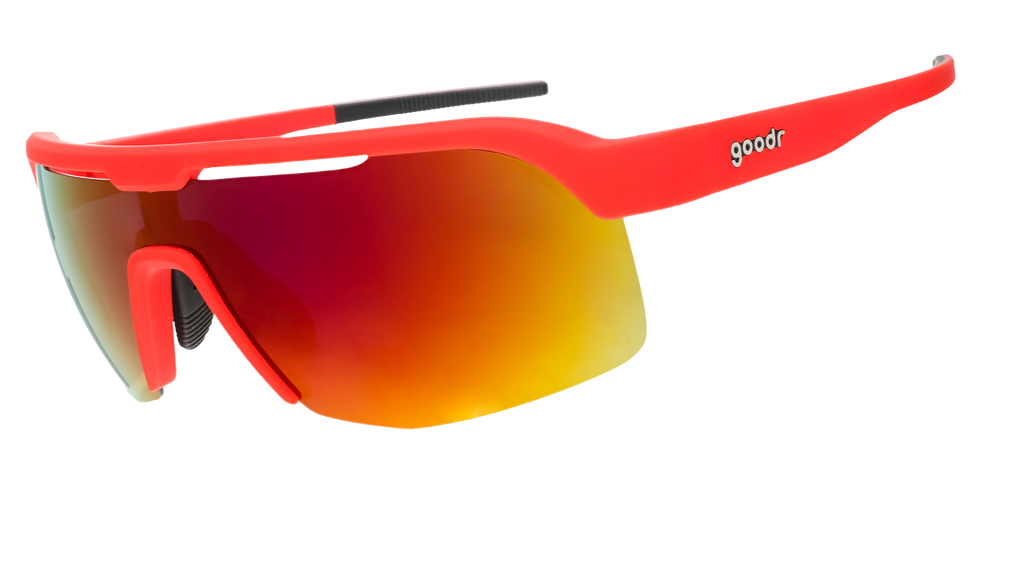 Sports sunglasses with a bright red frame and a wraparound reflective lens with an orange-red gradient.