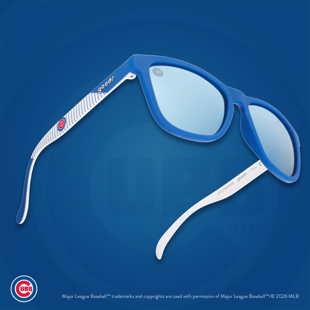 Three-quarter angle view of a pair of Cubs sunnies floating against a blue background featuring the team's Wishbone C logo.