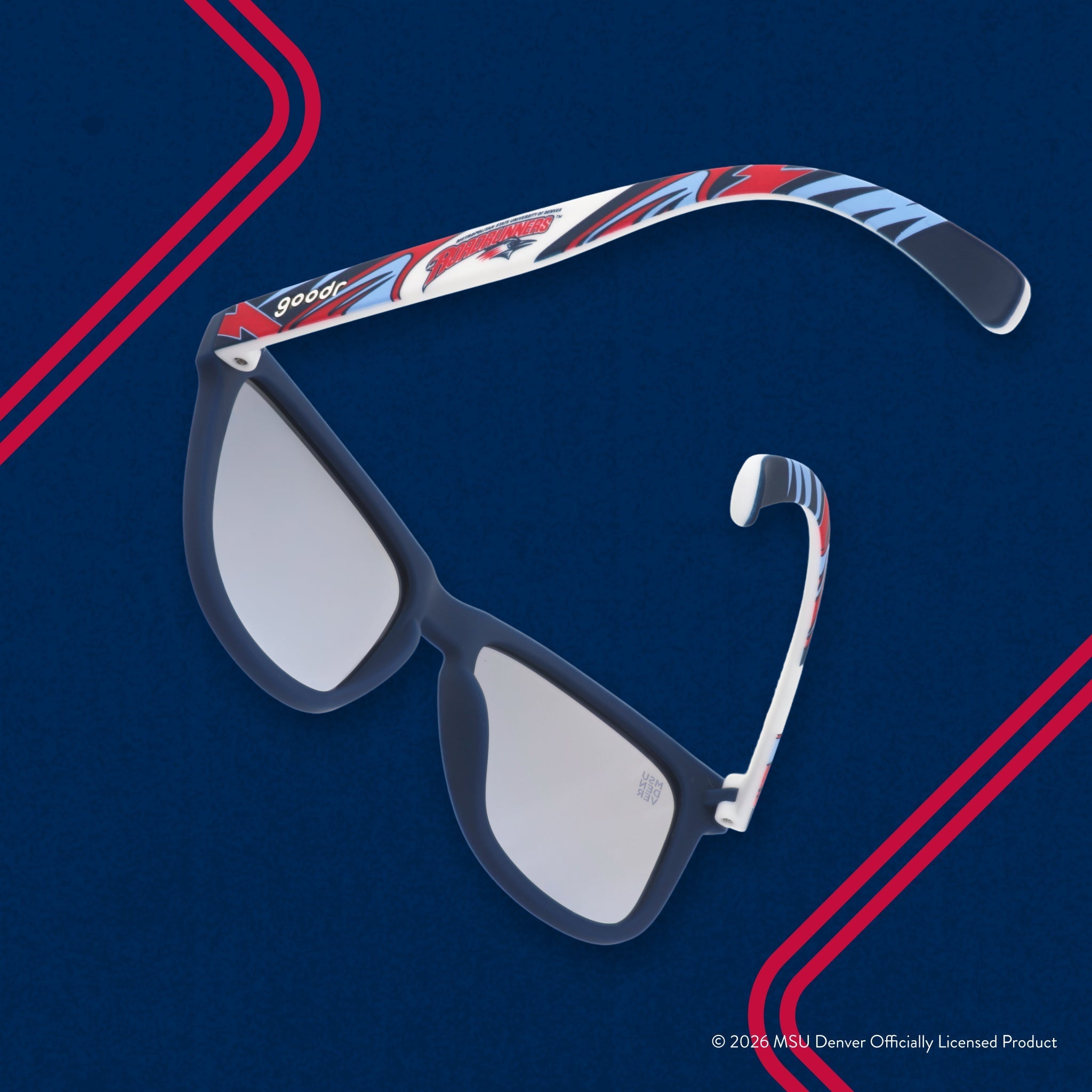 Back view of sunglasses tilted down. Solid blue frames w/ a red + white Roadrunners pattern + blue reflective lenses.