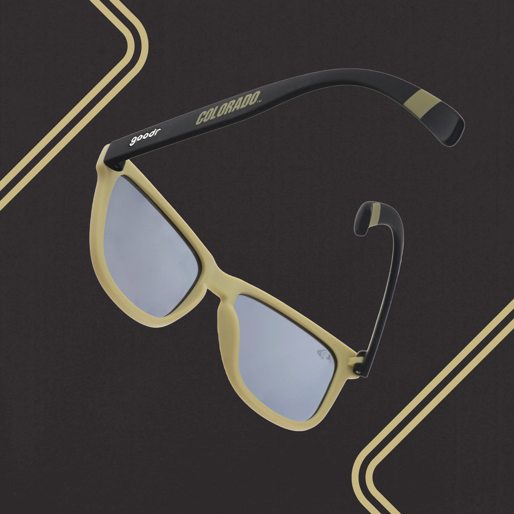 Three-quarter back angle view of light brown and brown sunglasses with a Colorado print and black lenses.