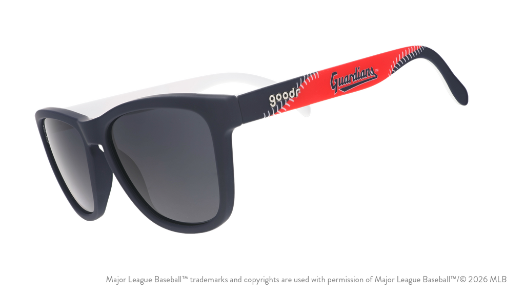 Three-quarter angle view of navy, red, and white shades featuring the Guardians script logo and white baseball stitch design.