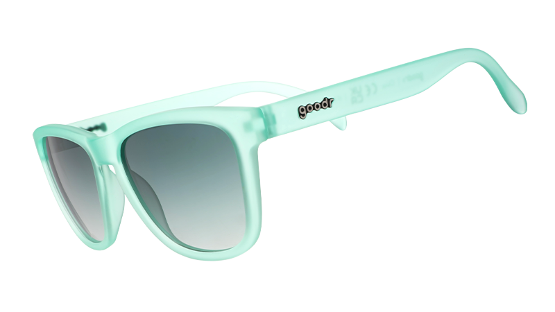 Light mint green sunglasses with a glossy finish, featuring gradient lenses and the "goodr" logo on the temple.