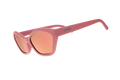 Pink sunglasses with a reflective lens on a white background