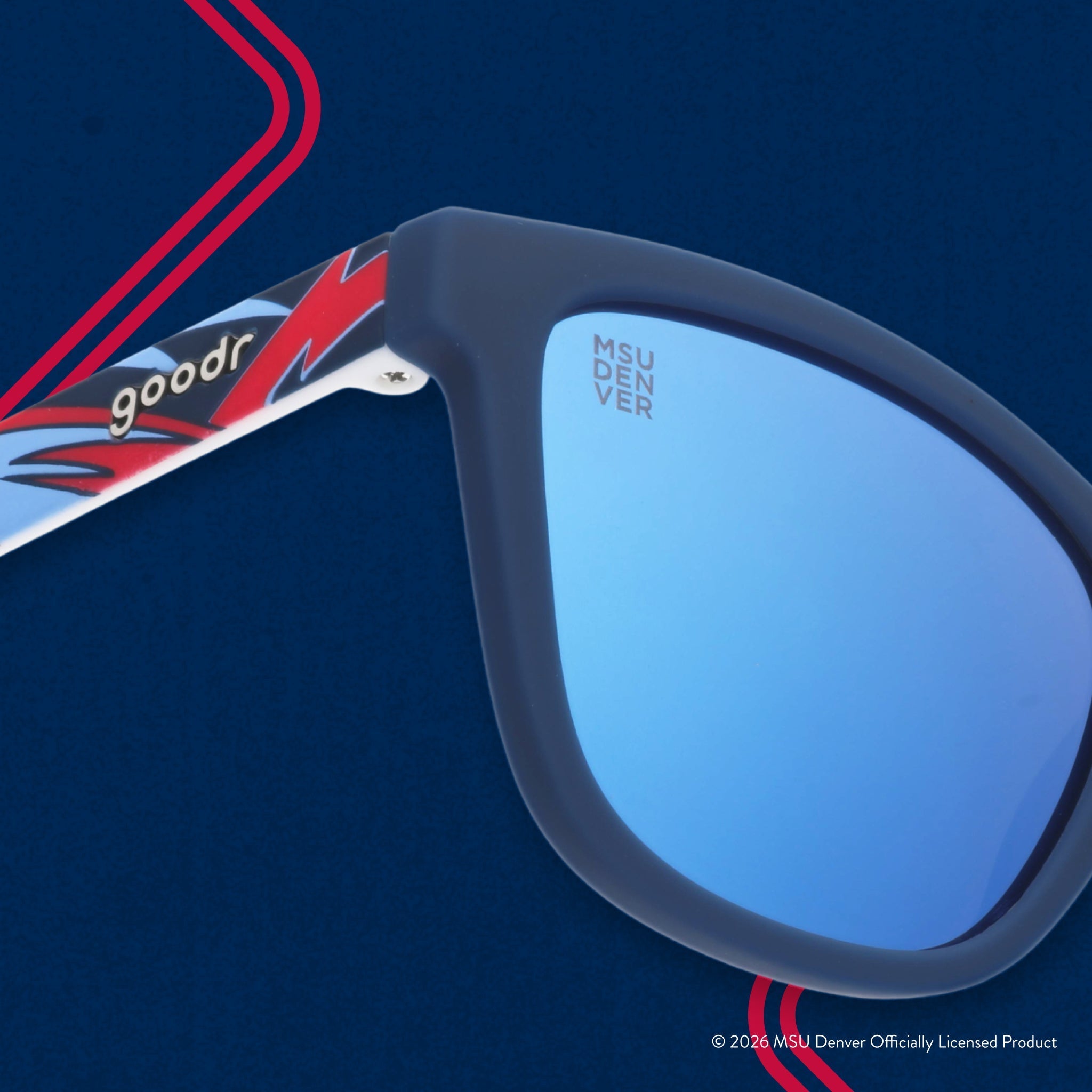Close-up view of shades. Blue frames w/ a red+white pattern. MSU DENVER etching in top corner of blue reflective lens.