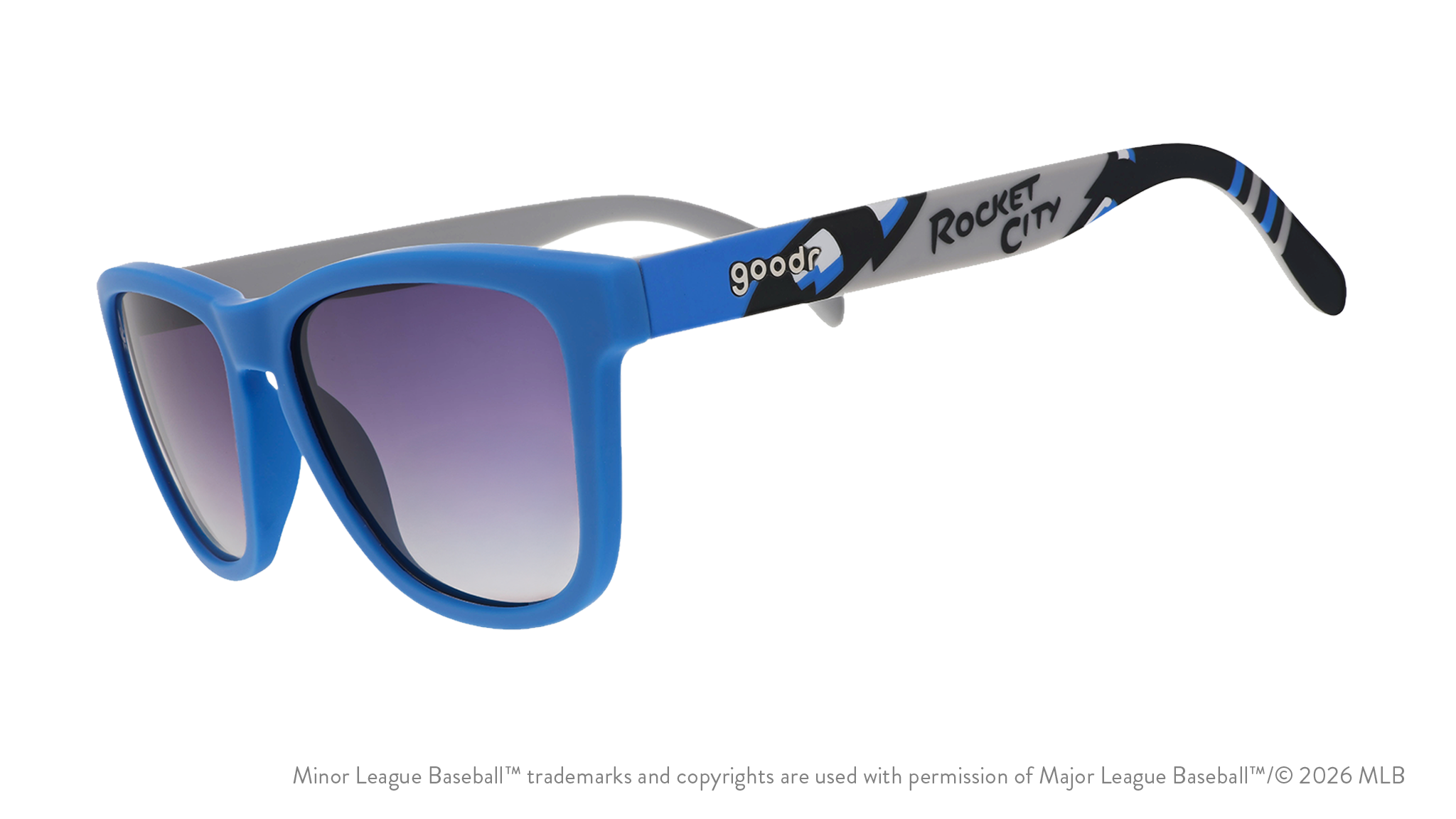 Three-quarter angle view of sunglasses tilted down. Blue frames w/ Rocket City on temples + black gradient lenses.