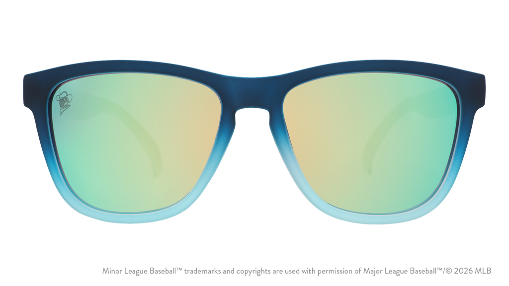 Front view of sunglasses. Blue front frame. Blue reflective lenses. Space Cowboys logo etching in top corner of lens.