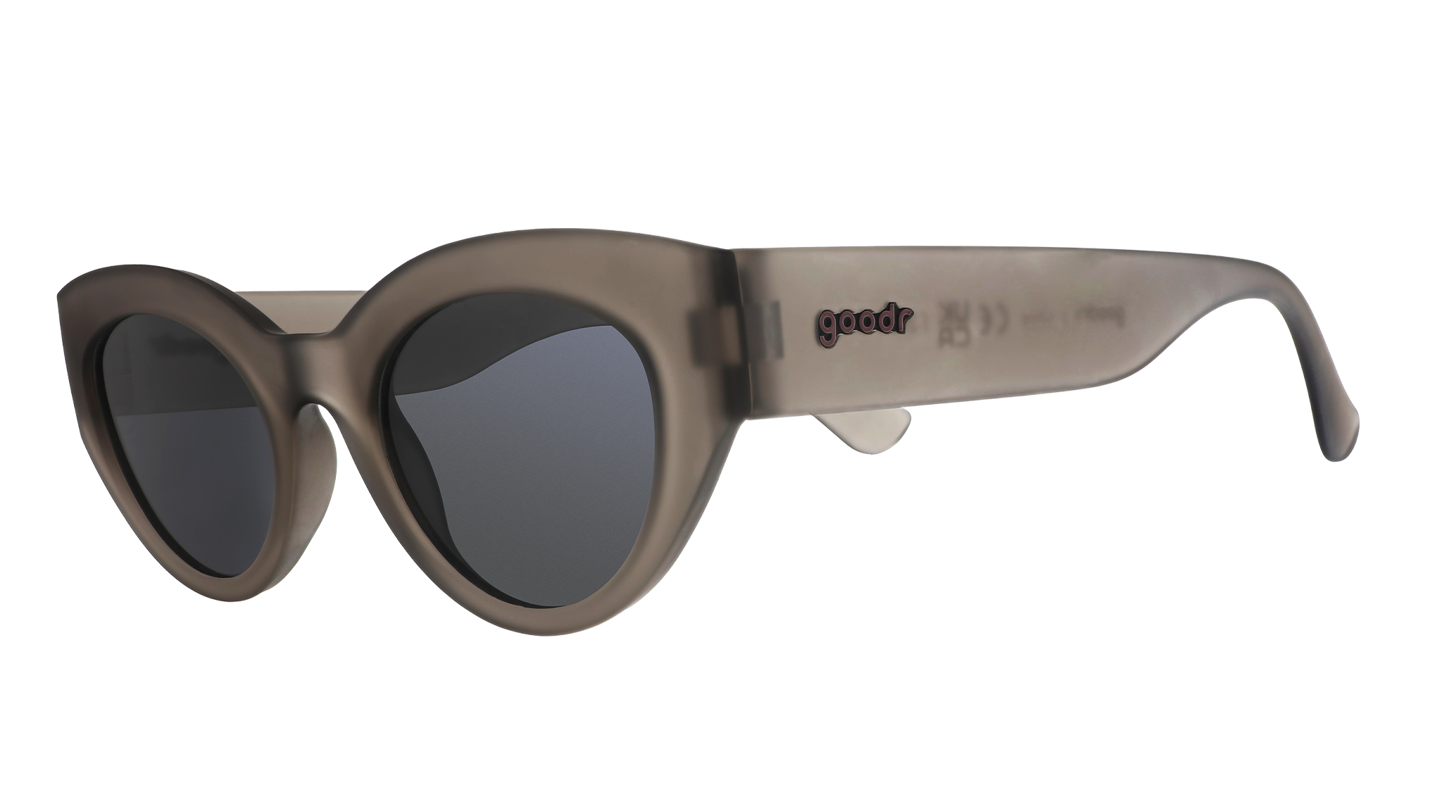 Three-quarter angle view of translucent dark gray, retro-inspired angled cat-eye sunglasses with black non-reflective lenses.