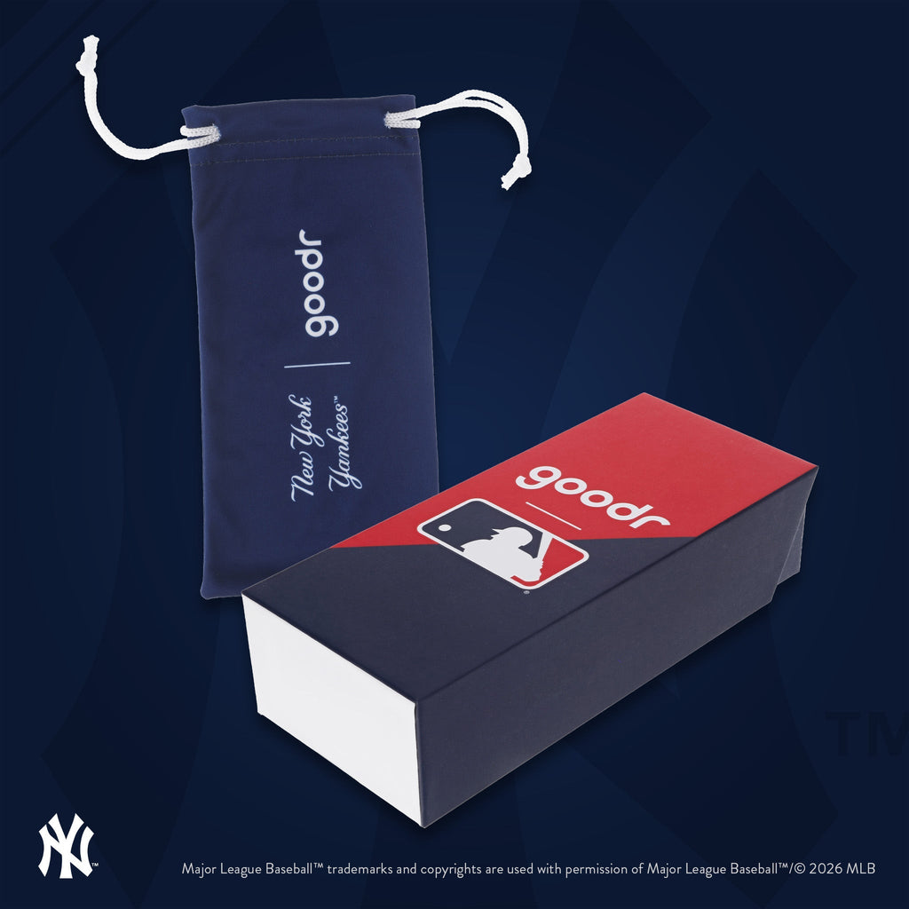 Photograph of custom packaging, featuring a blue microfiber bag with the Mets' script logo and MLB-themed box.