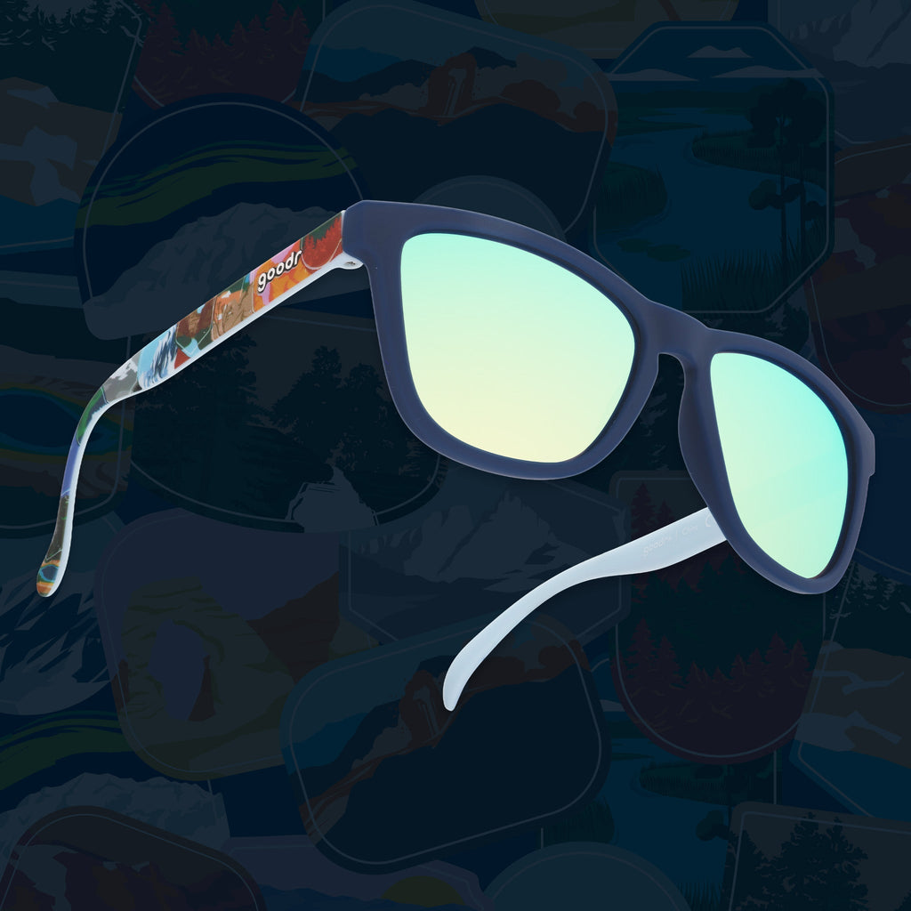 Navy sunglasses with blue reflective lenses and colorful National Park Foundation temple artwork.