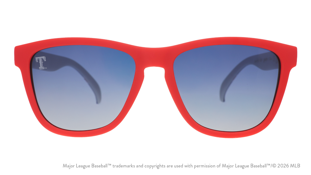 Front view of Rangers sunglasses with a red faceplate and blue gradient lenses featuring a T etched on the left side lens.