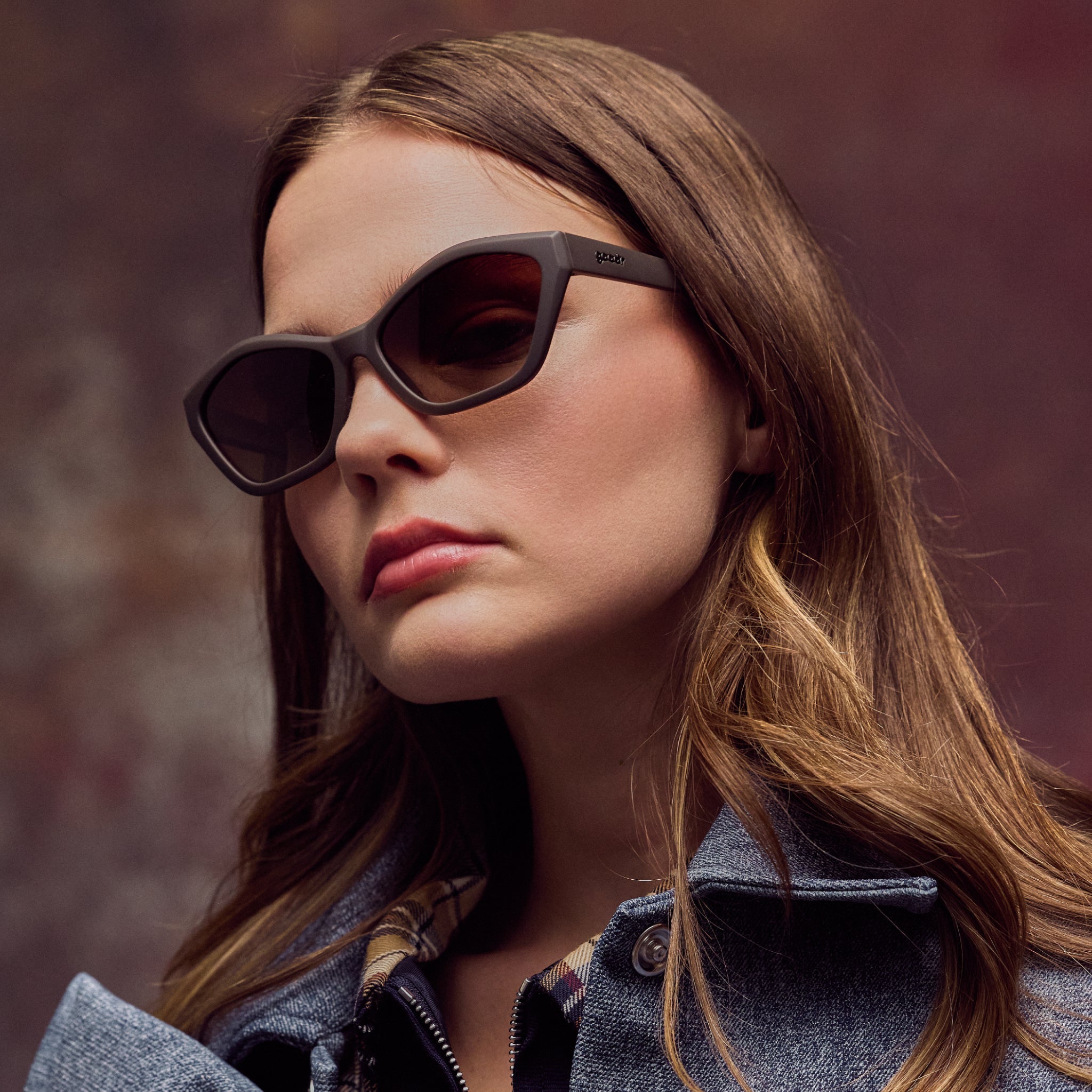 Woman wearing sunglasses with a blurred background