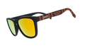 Three-quarter angle view of MLS Houston Dynamo FC shades tilted down. Black+orange frames. Amber reflective lenses.