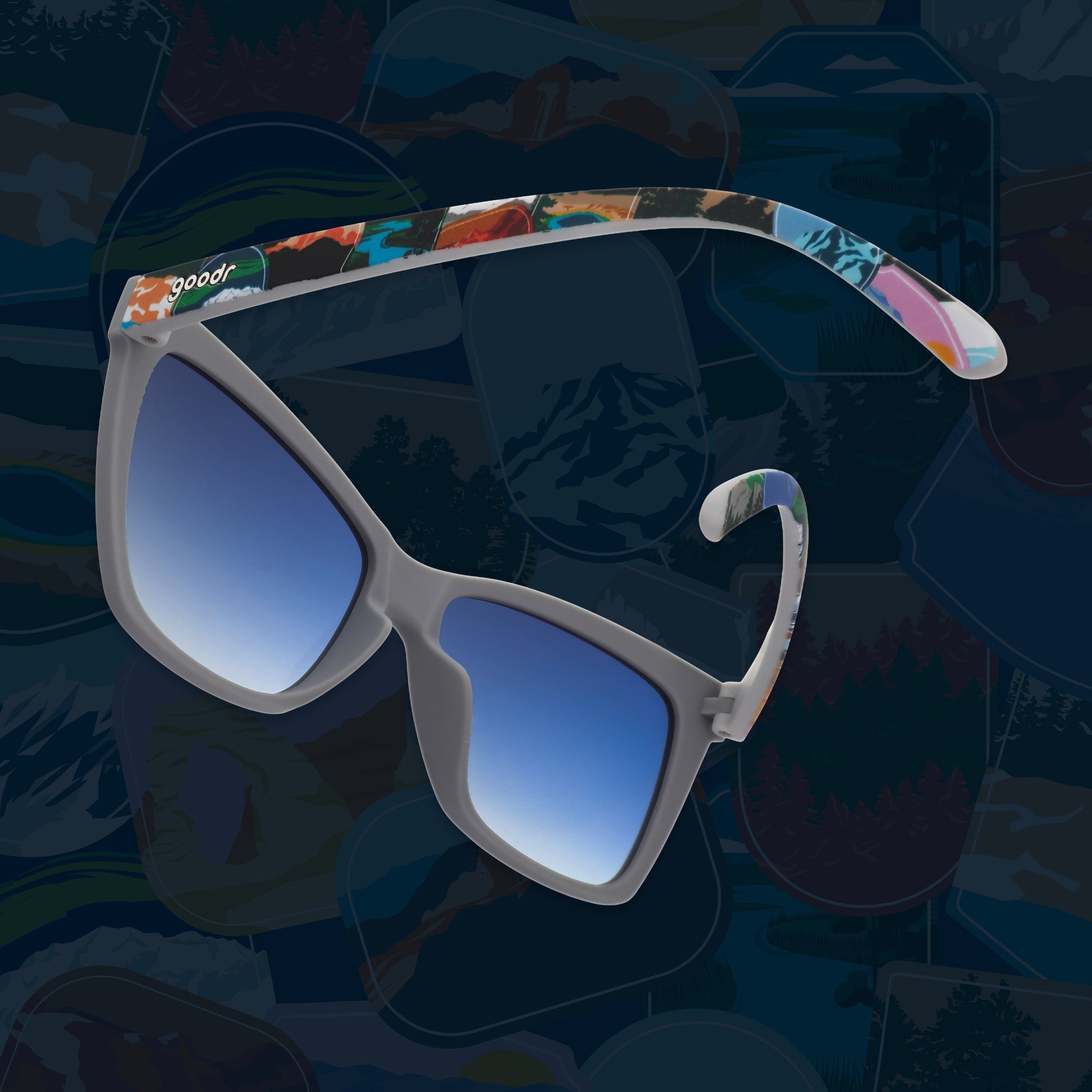 Side view of gray sunglasses with blue gradient lenses and colorful National Park Foundation temples.