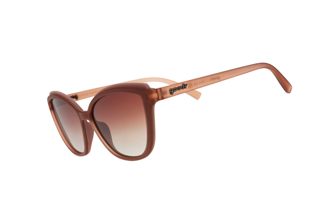 Brown sunglasses with gradient lenses on a white background
