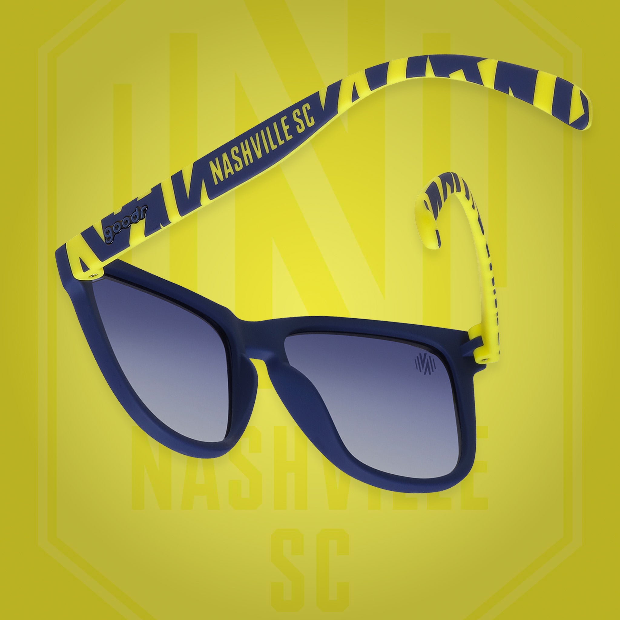 Back view of sunglasses tilted down. Blue frames w/striped yellow pattern+Nashville SC on temples. Blue gradient lenses.