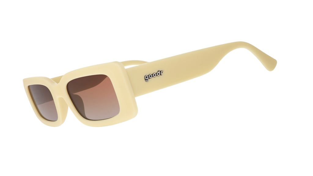 Three-quarter angle view of yellow rectangular sunglasses with brown-tinted polarized lenses against a white background.