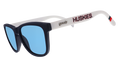 Three-quarter angle view of navy blue and white sunglasses with the Huskies logo and blue lenses.