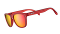 Three-quarter angle view of square-shaped sunglasses with red translucent frames and red reflective lenses.