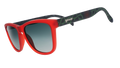 Three-quarter angle view of red and black frames with a green thorn pattern, green gradient lenses, and the Portland Thorns logo.