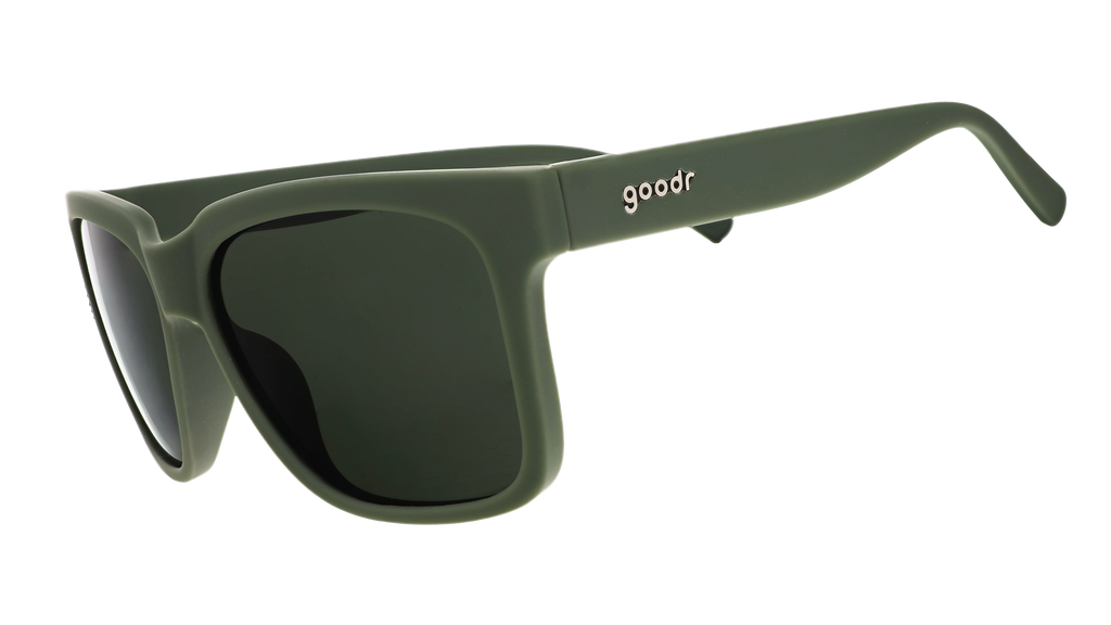 Three-quarter angle view of dark green sunglasses with green lenses designed to float in water.