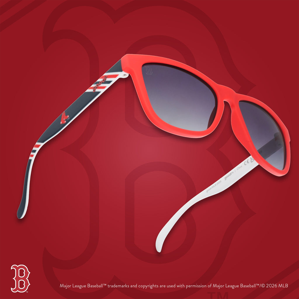Three-quarter angle view of red, white, and navy Red Sox sunglasses floating against a red background with the Boston B logo.