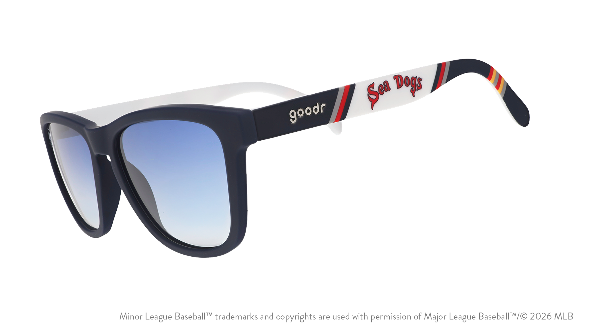 Three-quarter angle view of sunglasses. Dark blue frames w/ Sea Dogs on temples + blue gradient lenses.