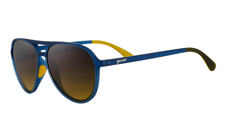 Three-quarter angle view of navy blue aviator sunglasses with dark amber gradient lenses.