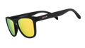 Three-quarter angle view of black sunglasses with square-shaped hot pink reflective lenses.