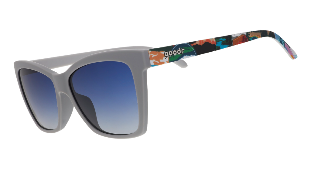 Gray sunglasses with blue gradient lenses and colorful National Park Foundation artwork on the temples.