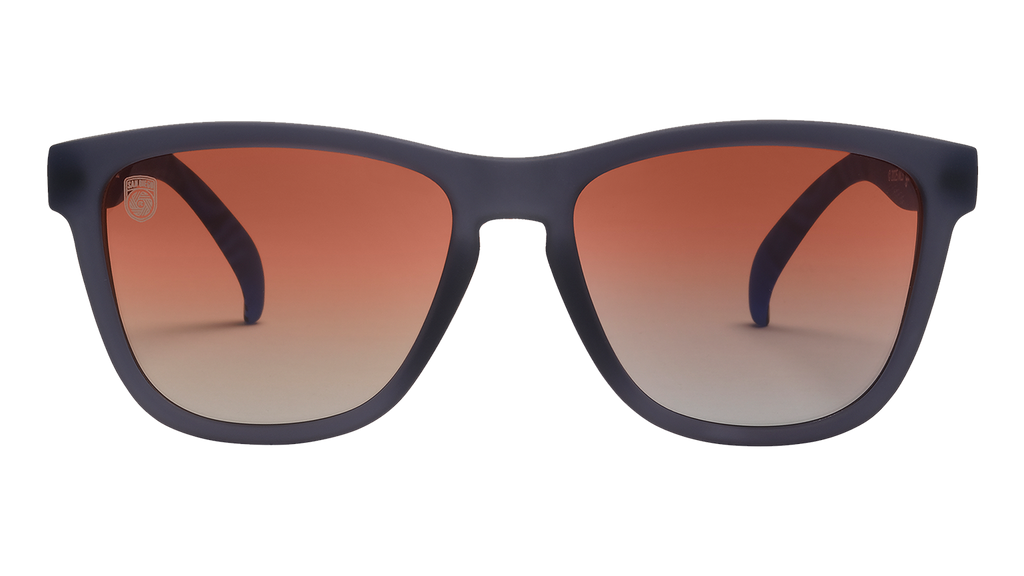 Front view of Major League Soccer San Diego FC sunglasses. Dark gray front frame. Orange gold gradient lenses.
