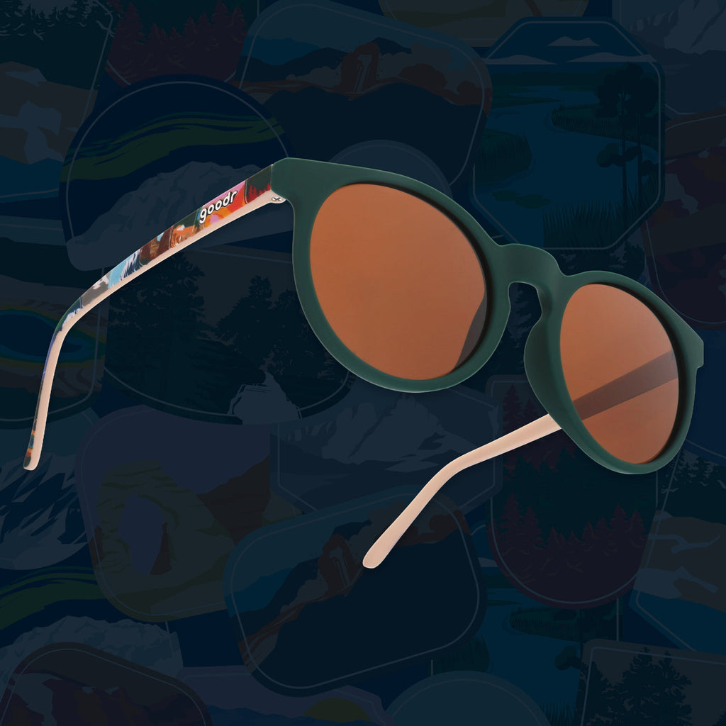Green round sunglasses with brown non-reflective lenses and colorful National Park Foundation temple artwork.