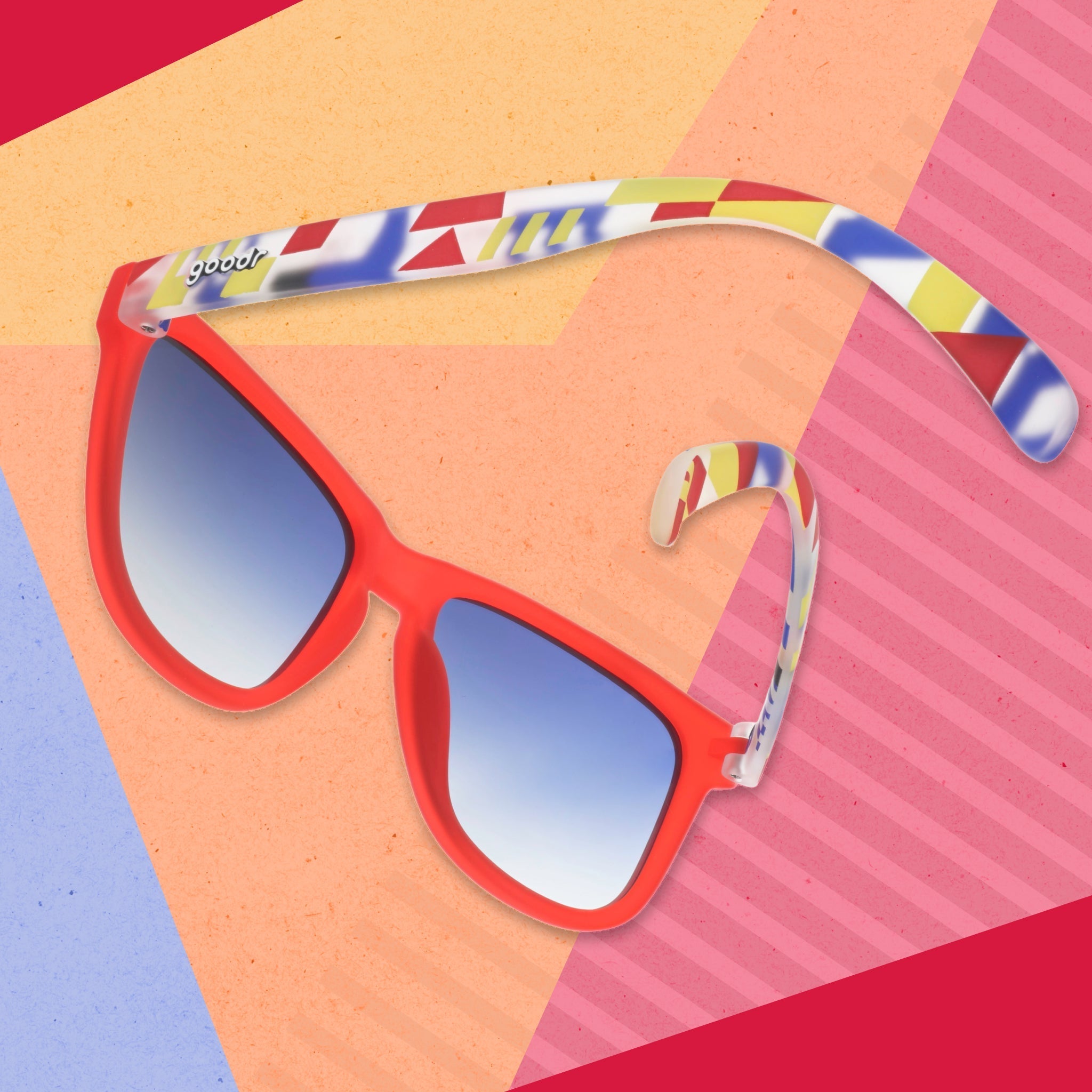 A pair of red sunnies depicting maritime signal flags on the arms is photographed from behind against a geometric background.