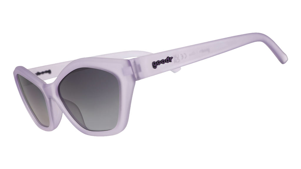 Three-quarter angle view of translucent pale purple geometric cat-eye Deco G sunglasses with black gradient lenses.