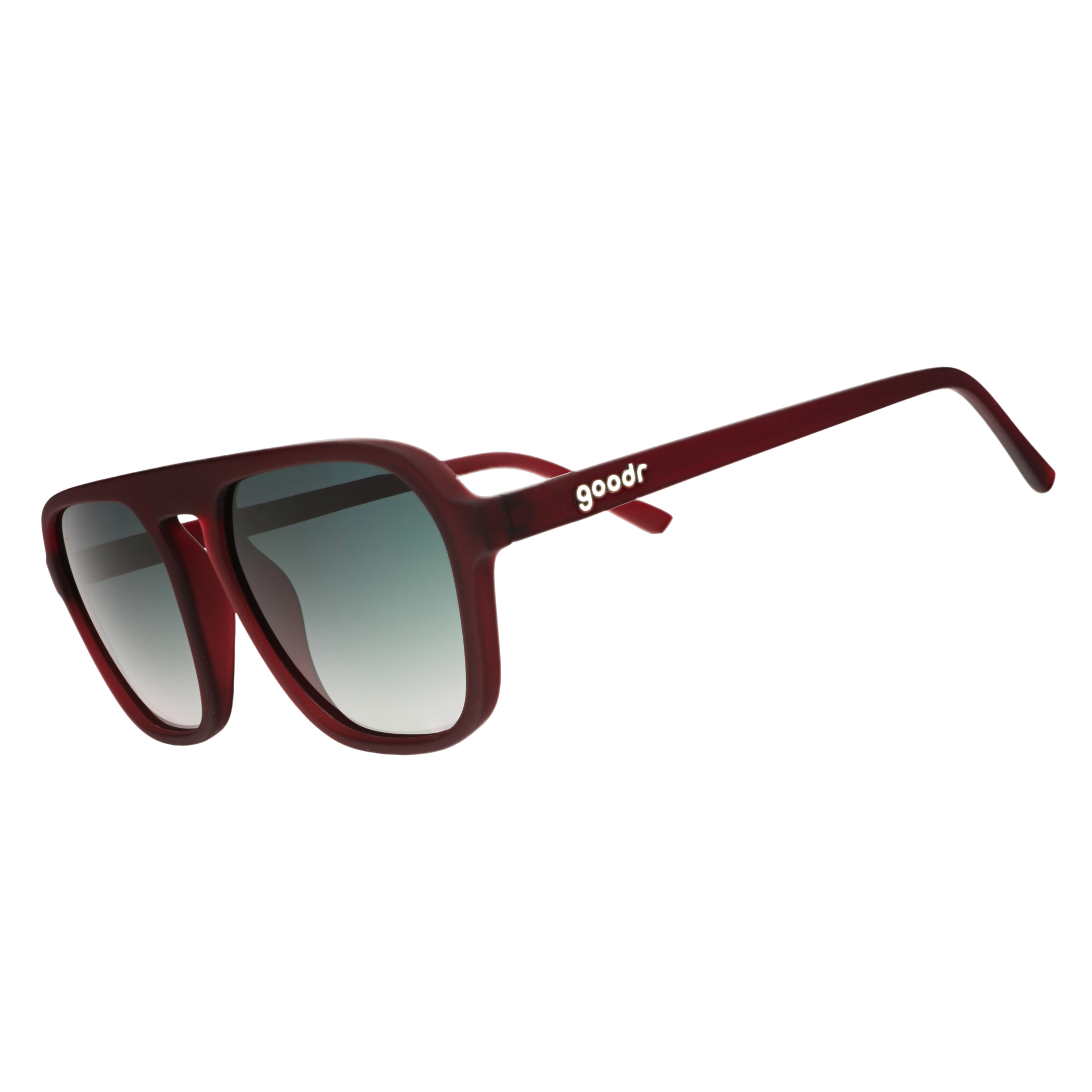 Three-quarter angle view of rust-brown Retro G sunglasses with green gradient lenses on a white background.