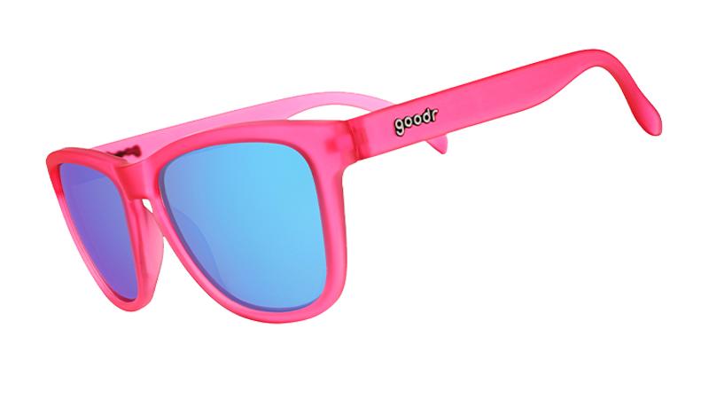 Three-quarter angle view of pink sunglasses with teal reflective lenses.