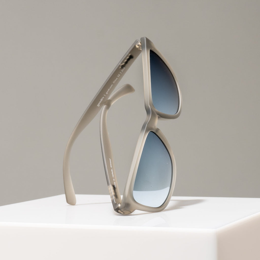 Sunglasses with a unique frame design on a neutral background