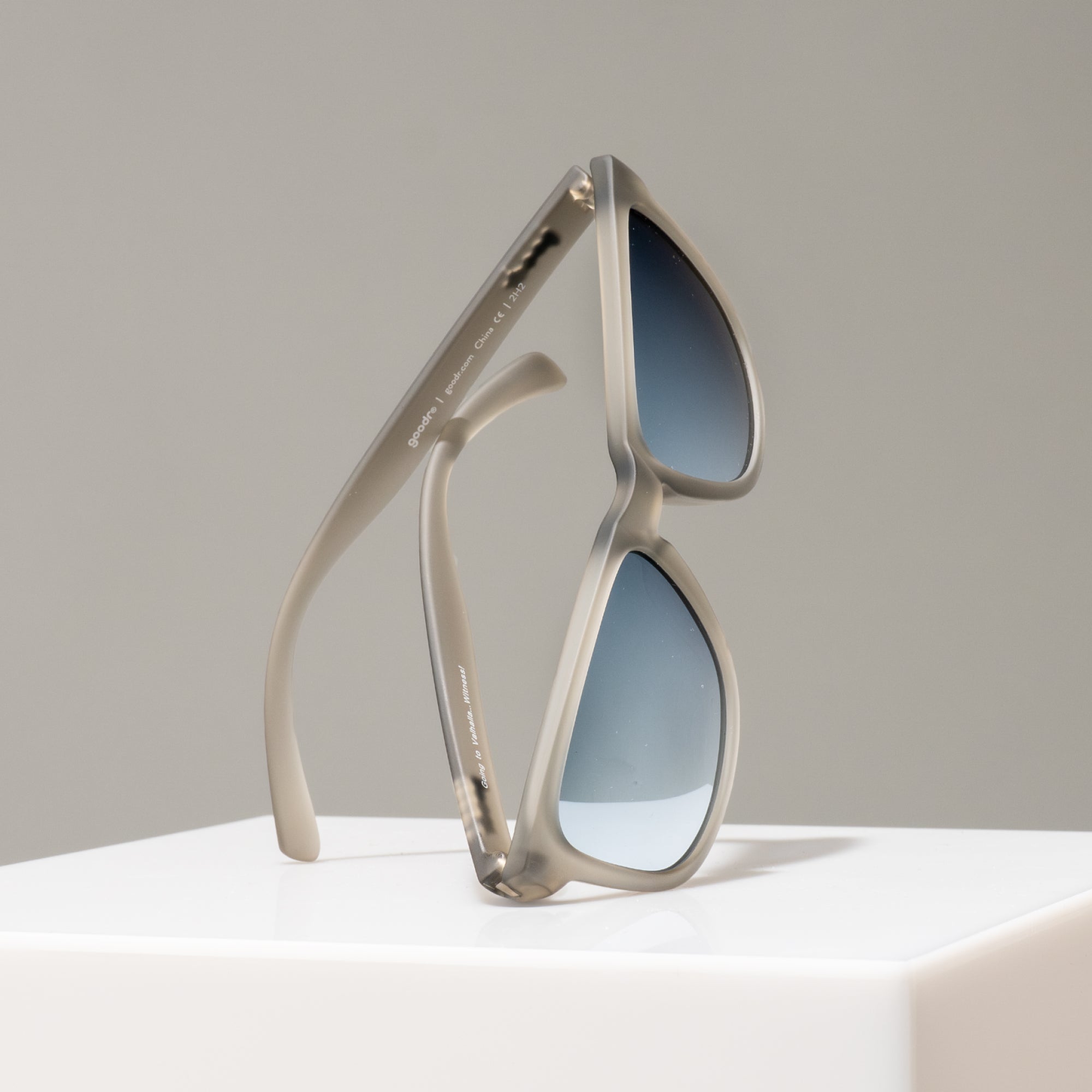 Sunglasses with a unique frame design on a neutral background