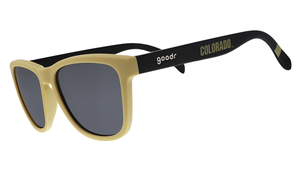 Three-quarter angle view of light brown and brown sunglasses with a Colorado print and black lenses.